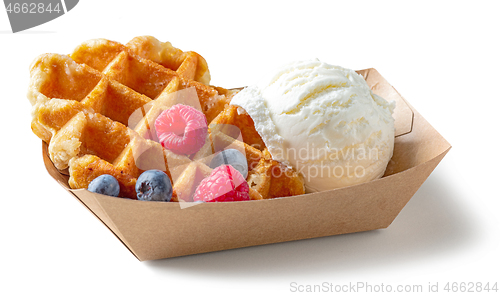 Image of belgian waffle with fresh berries and vanilla ice cream