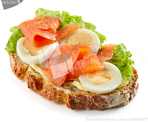 Image of bread slice with egg and salmon