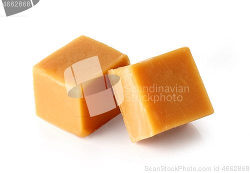 Image of caramel candies on white background