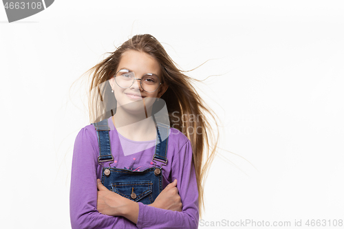 Image of Portrait of a cheerful authentic girl with developing hair