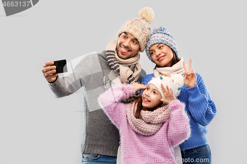 Image of happy family taking selfie by smartphone