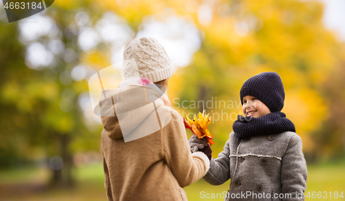 Image of smiling children in autumn park