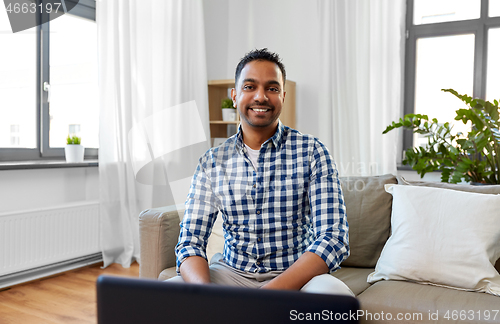 Image of indian male blogger videoblogging at home