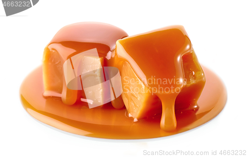 Image of caramel candies on white background