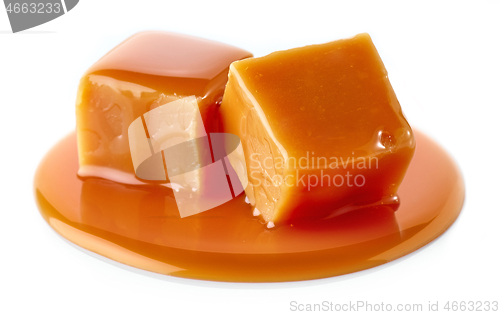 Image of caramel candies on white background