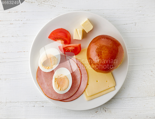 Image of plate of cheese and ham sausage