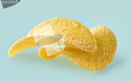 Image of potato chips on blue background