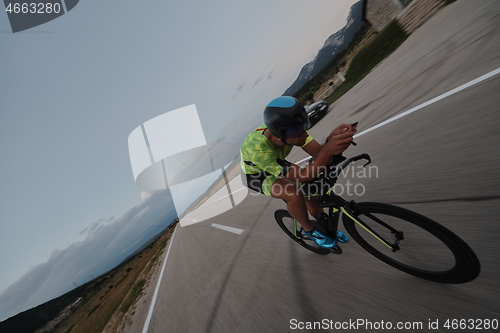 Image of triathlon athlete riding bike