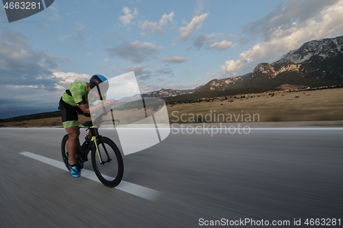 Image of triathlon athlete riding bike