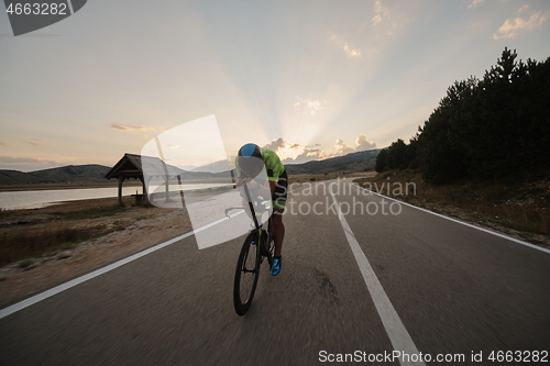 Image of triathlon athlete riding bike