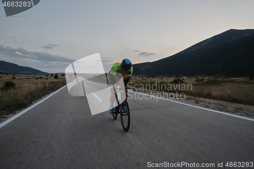 Image of triathlon athlete riding bike