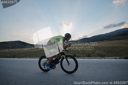 Image of triathlon athlete riding bike