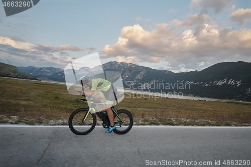 Image of triathlon athlete riding bike