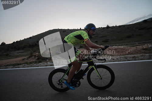 Image of triathlon athlete riding bike