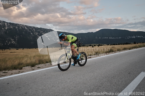 Image of triathlon athlete riding bike