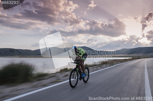 Image of triathlon athlete riding bike