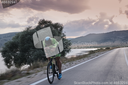 Image of triathlon athlete riding bike