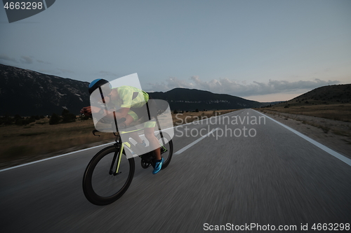 Image of triathlon athlete riding bike