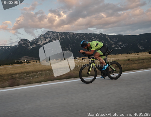 Image of triathlon athlete riding bike