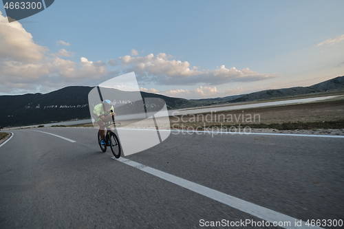 Image of triathlon athlete riding bike