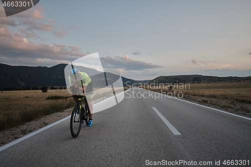 Image of triathlon athlete riding bike