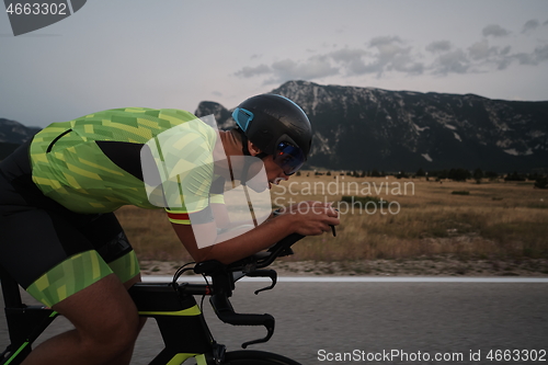 Image of triathlon athlete riding bike