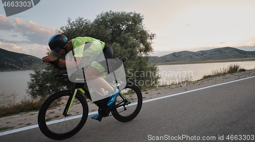 Image of triathlon athlete riding bike