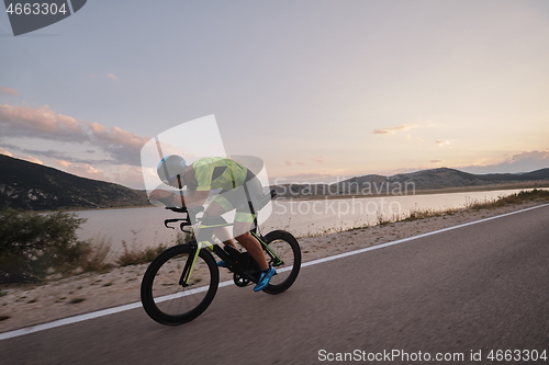 Image of triathlon athlete riding bike