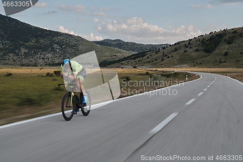 Image of triathlon athlete riding bike