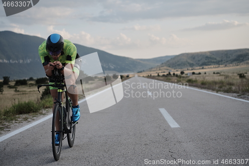 Image of triathlon athlete riding bike