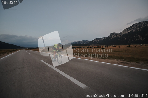 Image of triathlon athlete riding bike