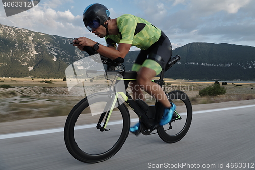 Image of triathlon athlete riding bike