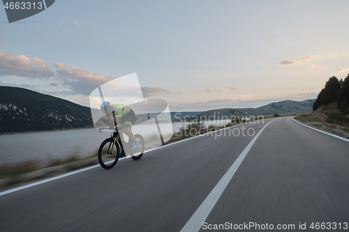 Image of triathlon athlete riding bike