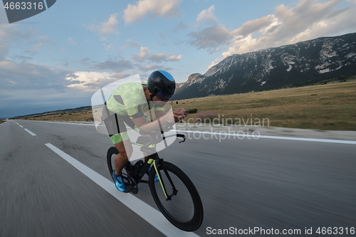 Image of triathlon athlete riding bike