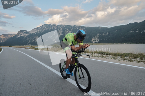 Image of triathlon athlete riding bike