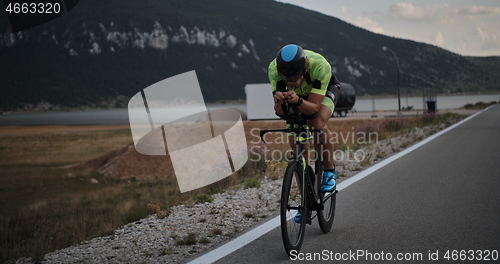 Image of triathlon athlete riding bike