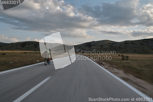 Image of triathlon athlete riding bike