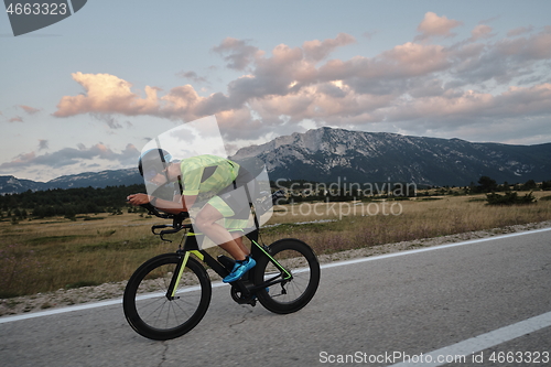 Image of triathlon athlete riding bike