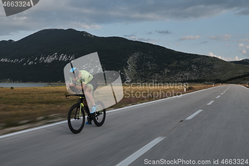 Image of triathlon athlete riding bike