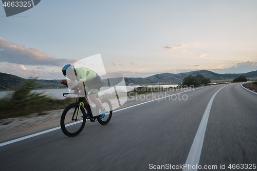 Image of triathlon athlete riding bike