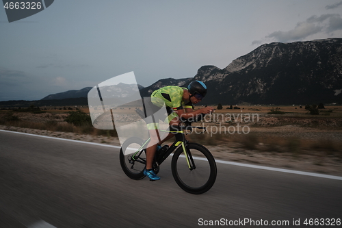 Image of triathlon athlete riding bike