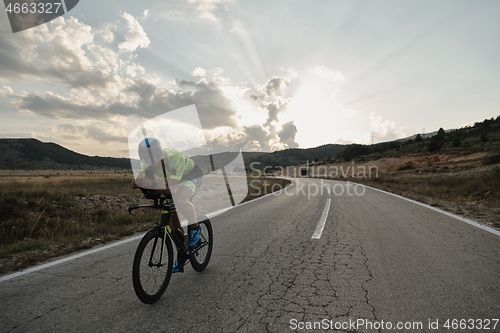 Image of triathlon athlete riding bike