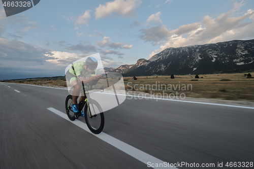 Image of triathlon athlete riding bike