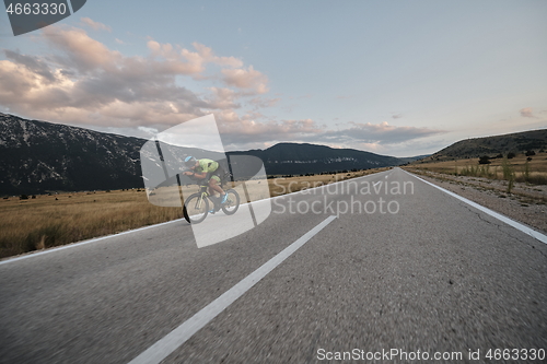 Image of triathlon athlete riding bike