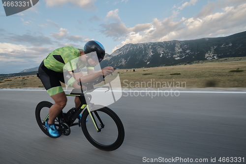 Image of triathlon athlete riding bike