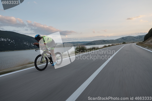 Image of triathlon athlete riding bike