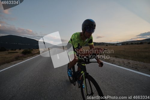 Image of triathlon athlete riding bike