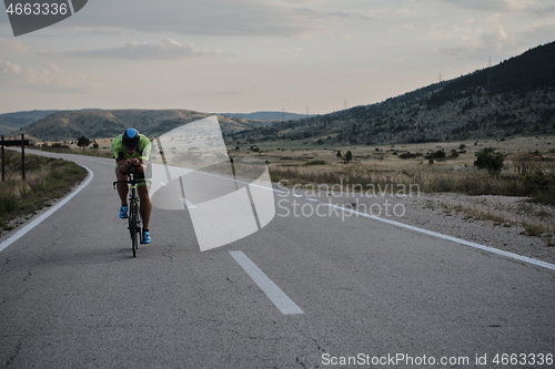 Image of triathlon athlete riding bike