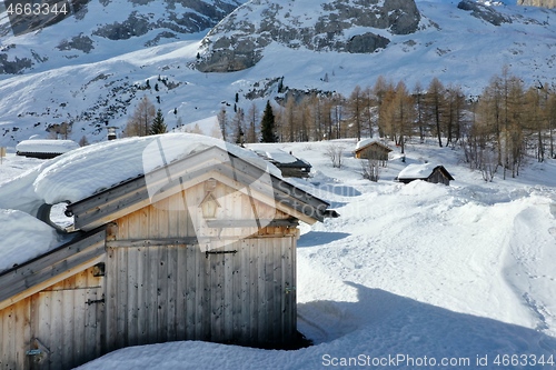 Image of aerial snow covered mountain peaks in alps at winter 