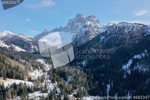 Image of aerial snow covered mountain peaks in alps at winter 